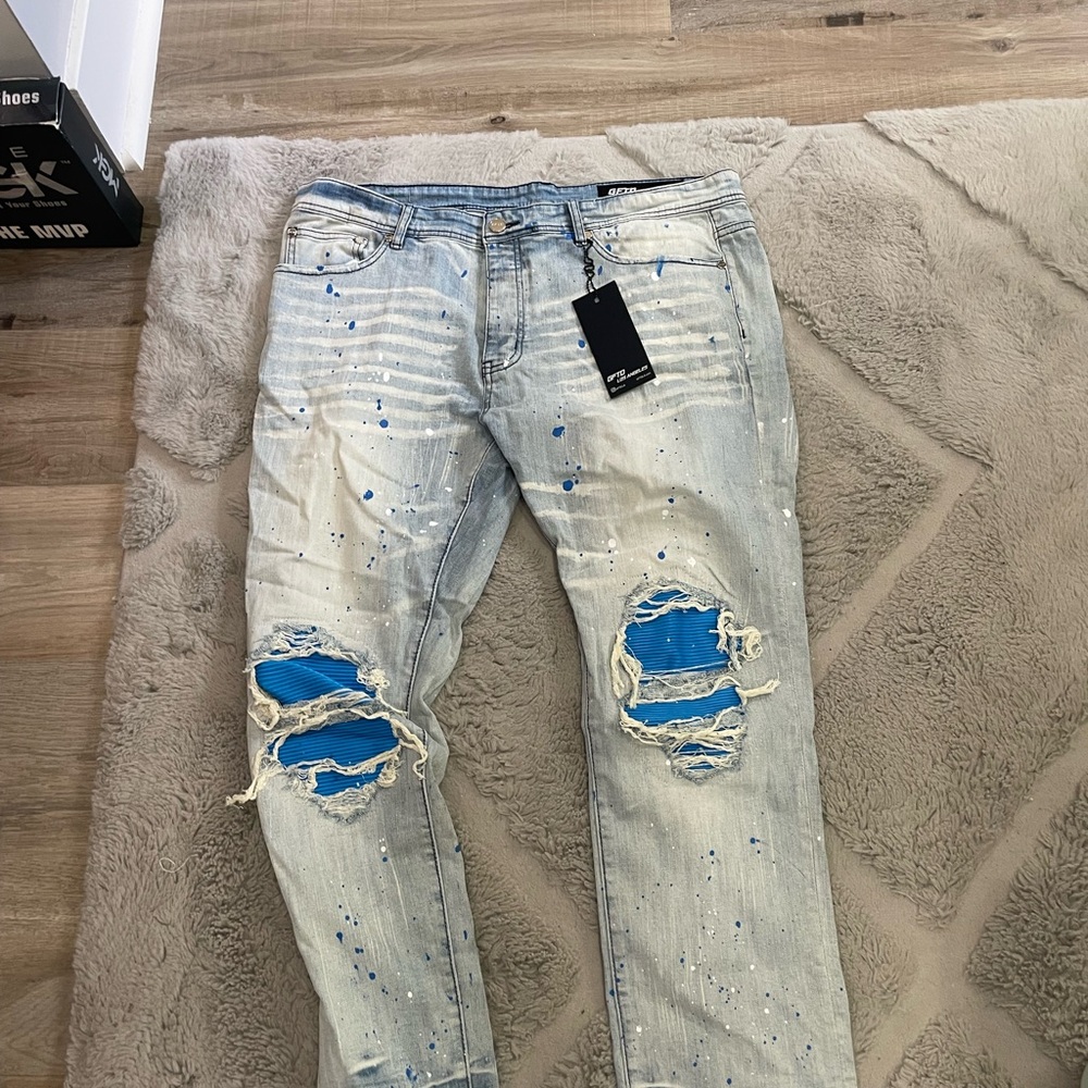 Distressed Light Blue Jeans with Paint Splatter